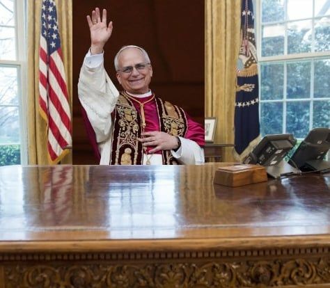 Image of Pope Leo XIV sitting behind the US President's desk in the White House Oval office. Designed to parody the AI image of Pres. Trump as Pope.I 