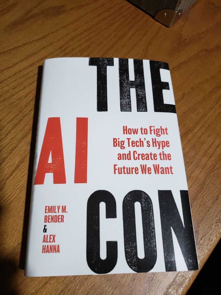 A photo of the book, The AI Con, by Emily Bender and Alex Hanna.
