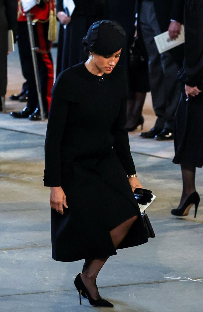 Duchess of Sussex Meghan Markle curtsy at Queen Elizabeth II funeral.