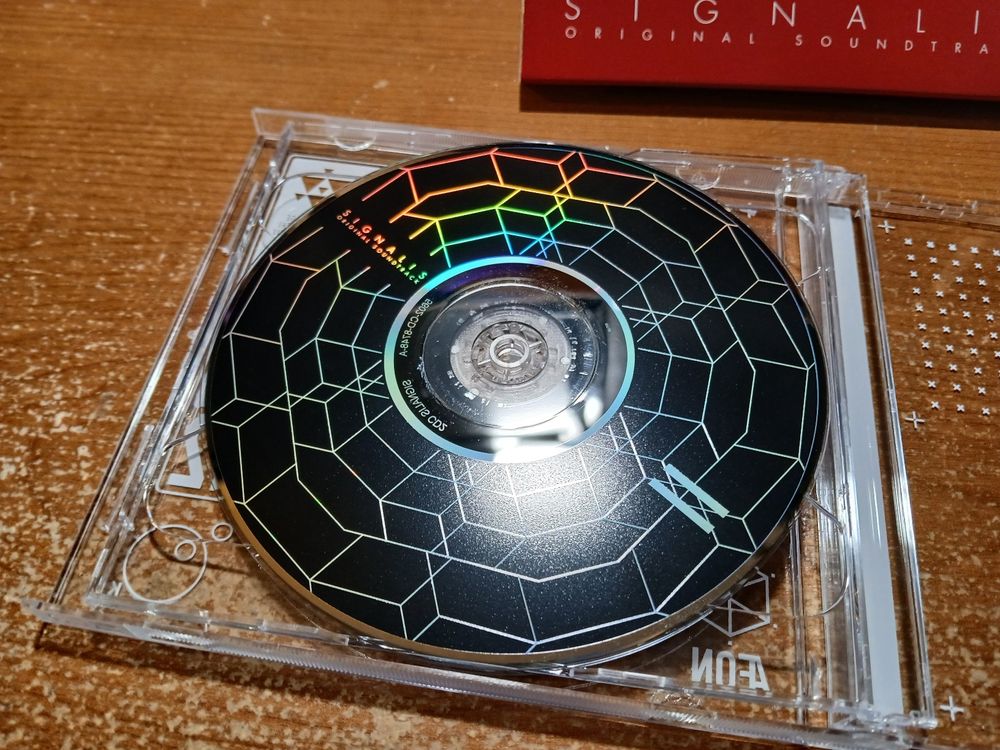 Close up of disc II, with a black background behind the artifact pattern. 