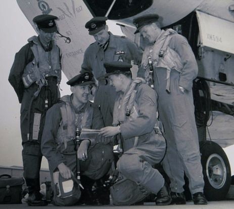 A 1960s Vulcan crew pictured in front of the crew access door of our XM594 at RAF Scampton 