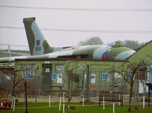 The large Avro Vulcan aircraft tries to hide behind the old café at our museum site 