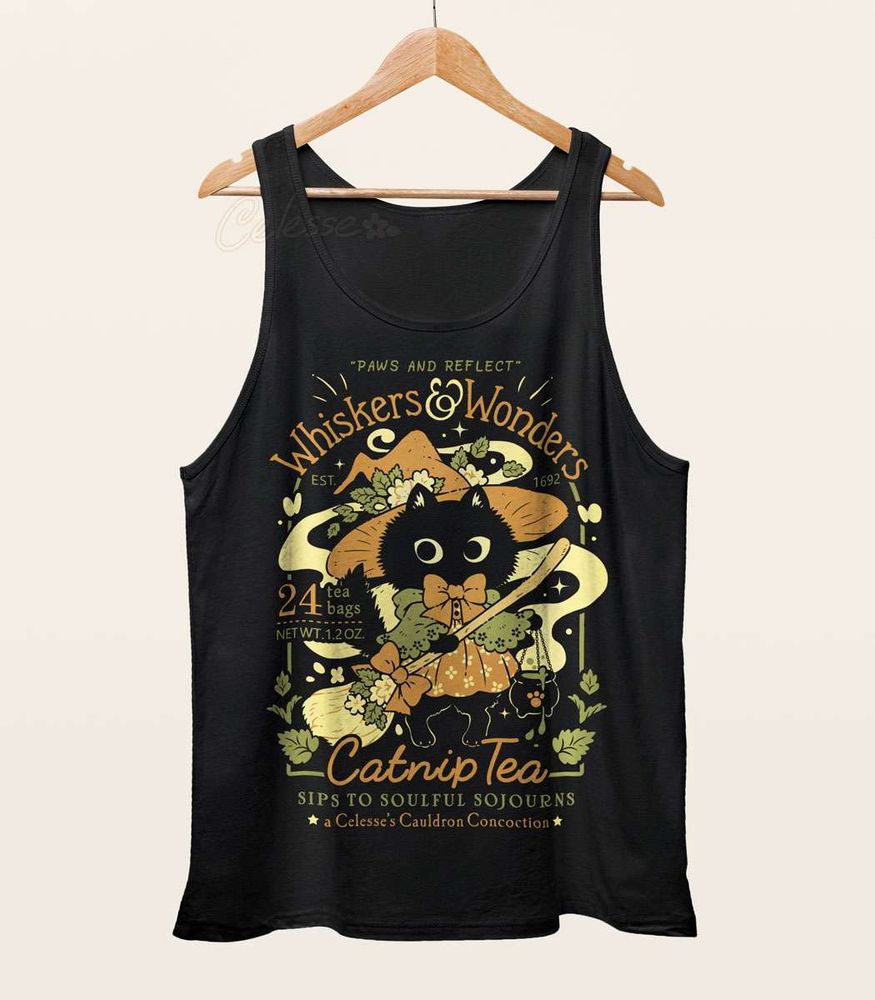 A black tank top on a wood hanger with a print featuring a faux logo for Whiskers & Wonders Catnip Tea with a black witch cat in a witch hat and dress with a broom.