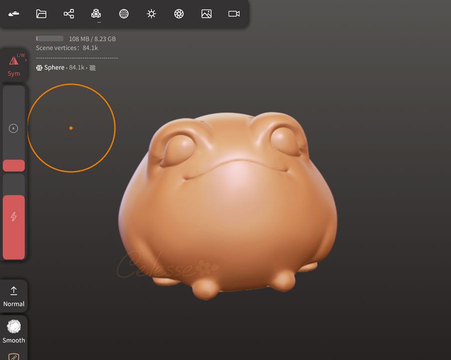 A cropped screenshot of a 3D modeling program featuring the front view of a WIP of an orange claylike model of a fat blob-shaped frog.