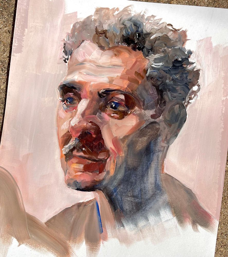 Oil painting of Irving from Severance in s2e9. Was going for sad/hopeful, but may have overshot to ‘about to cry’. I spent about an hour on this (1 layer).

Visible brushstrokes. Shadow tones red/brown on face fading into blue/grey. Off-white background with some of the paper still visible. Photographed on the ground outside. 