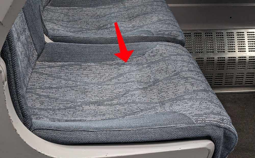 GWR seat with the specific defect in which the seat material compresses and an element of the underlying structure is exposed.