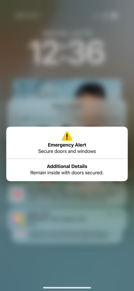 Apple alert saying to remain inside and secure doors and windows.