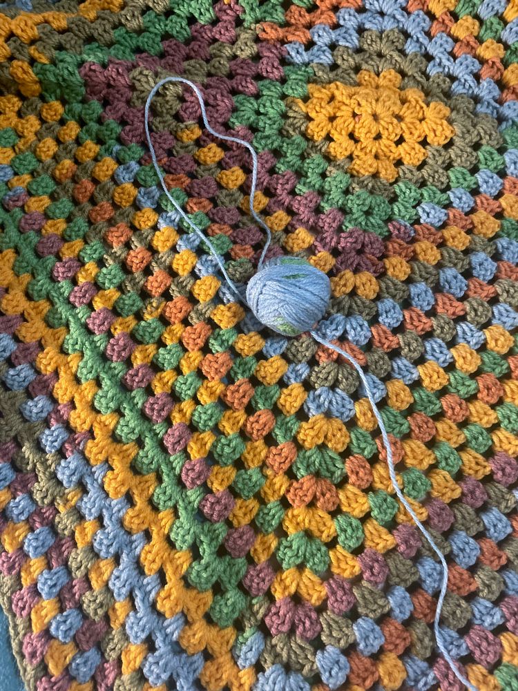 A granny square afghan in candy colored shades
