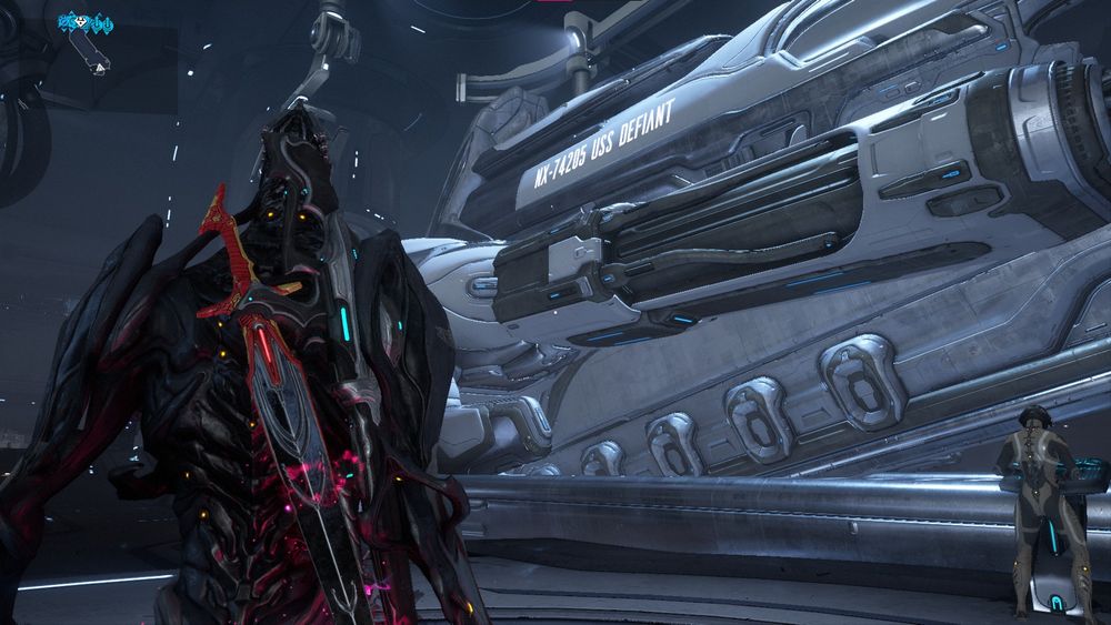 Picture of a Warframe Railjack with white text reading NX-74205 USS Defiant.