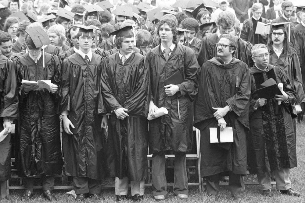 CMU students stand for Commencement in the rain. Image from the University Archives.