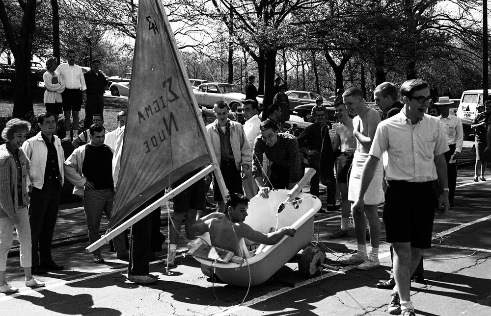 Caption from the CMU Digital Collections: (c.1963) During the special exhibition heat of the Spring Carnival buggy races, the concrete wheels on Sigma Nu fraternity's "Sailboat" entry fall apart just 10 feet from the finish line on Frew Street.