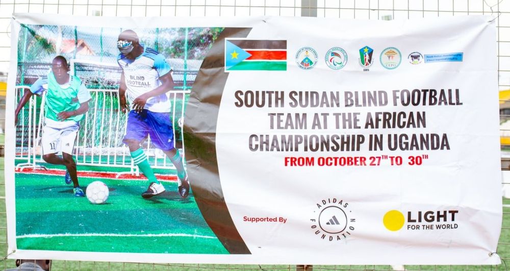 Banner showing South Sudan Blind Football team promotion for African Championship in Uganda, with players in action and logos.