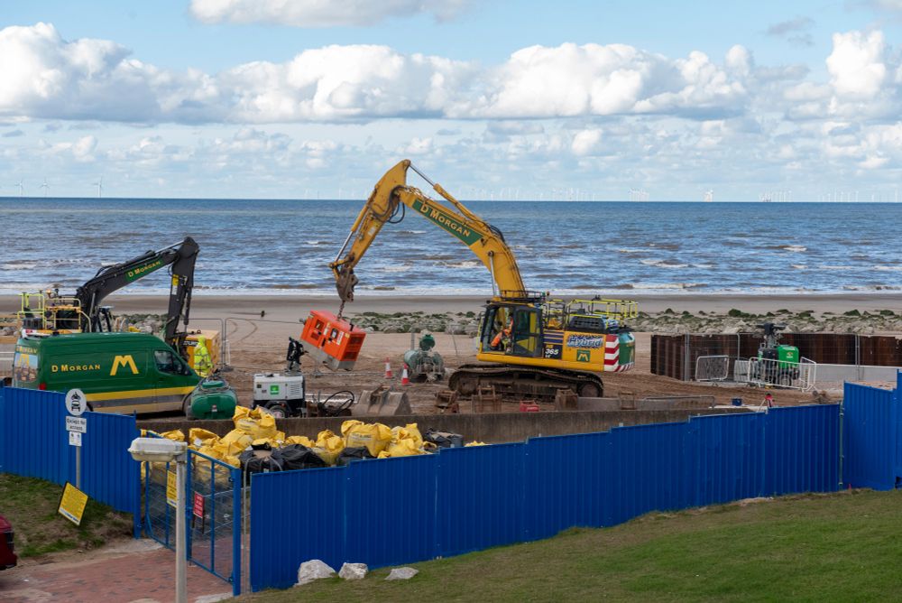Construction work on a sandy beach