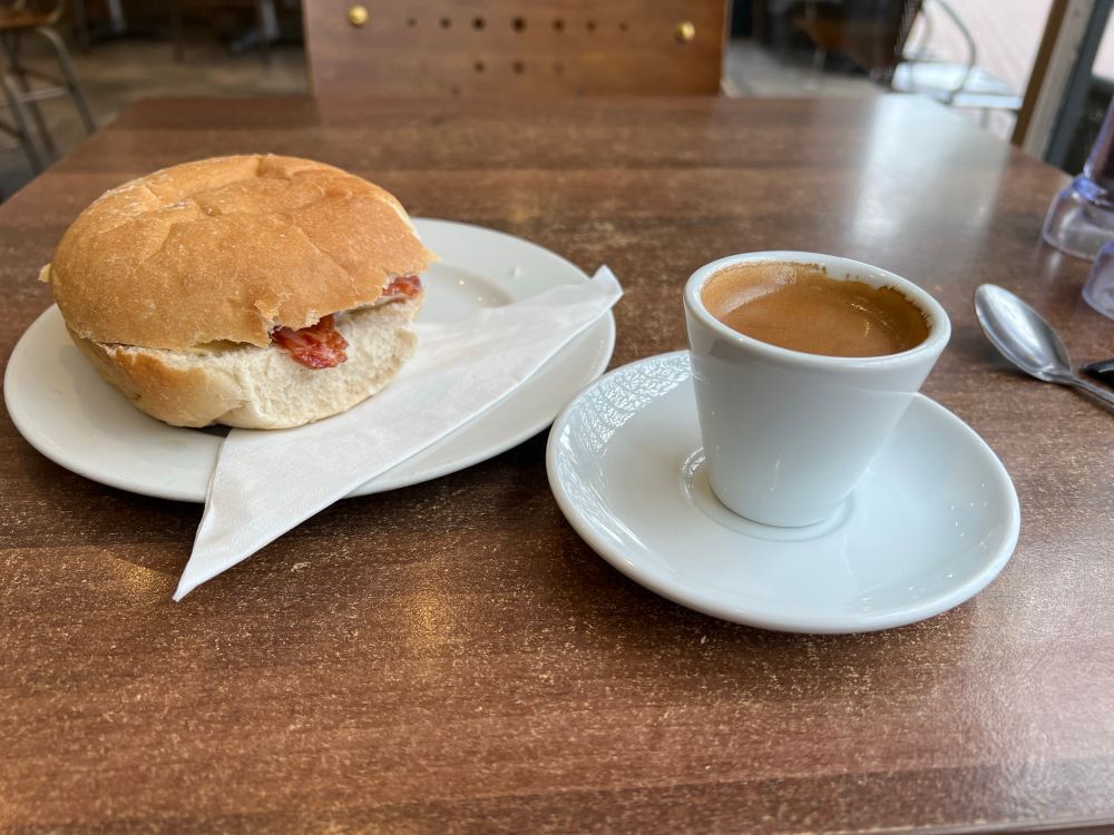 A bacon bap and espresso ready to consume 😊