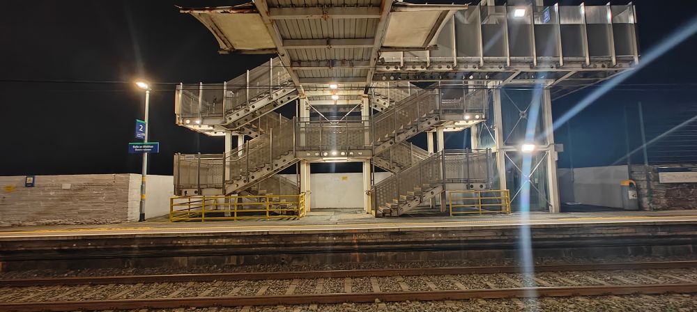 Image of the steel pedestrian bridge at Booterstown train station in Dublin