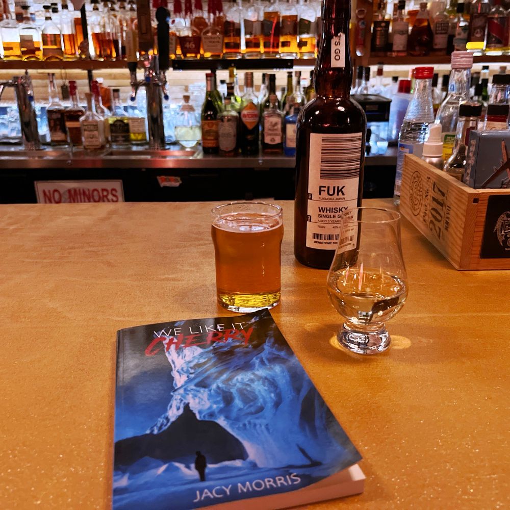Jacy Morris’ (unreleased) new novel ‘We Like It Cherry’ accompanied by a half pour of beer and Fuk whisky.