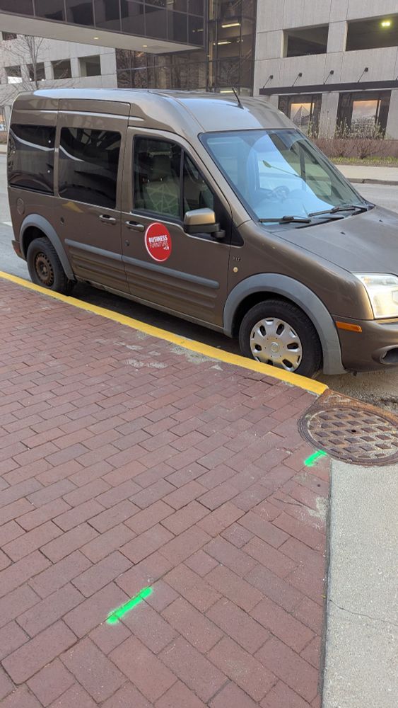 Another angle of work van parked in bike lane on New York Street at Illinois.