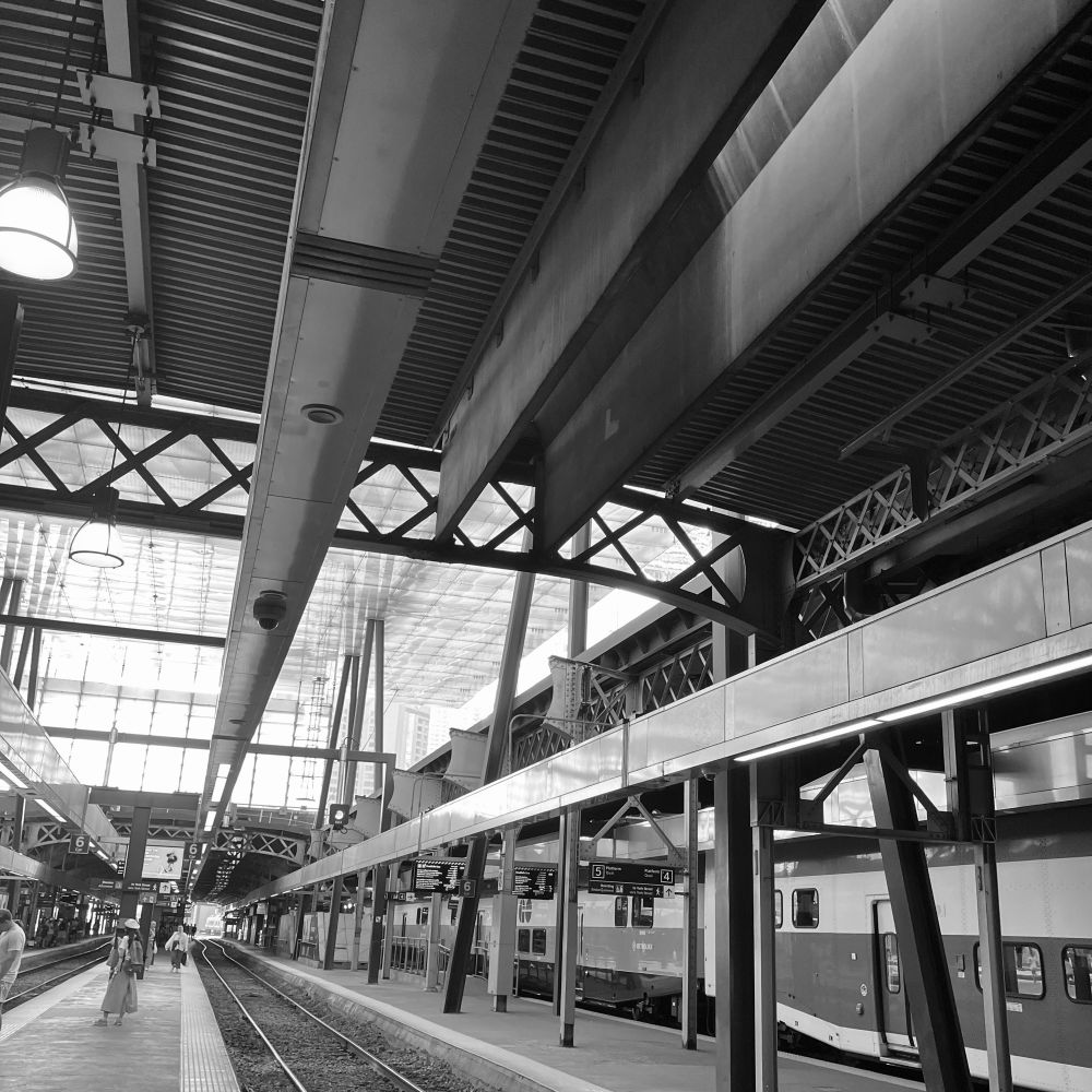 Many lines of tracks and station roof and overall structure on platform 7 at Toronto Union Station.