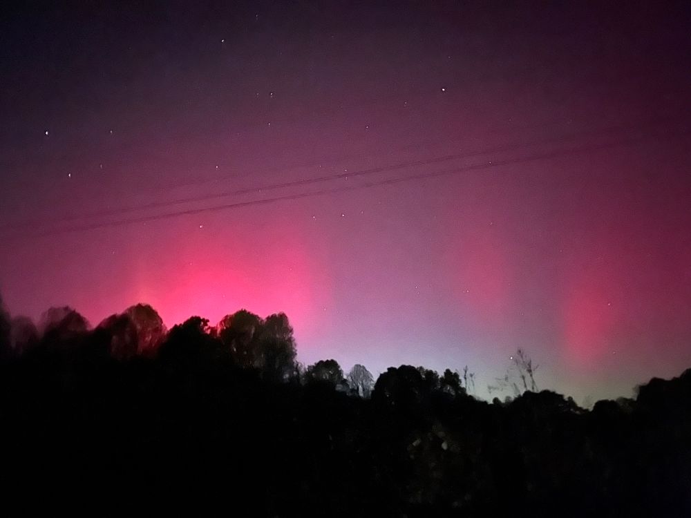 Teal, blue, pink, orange, and purple dance along the sky as the Auroras light of the night.