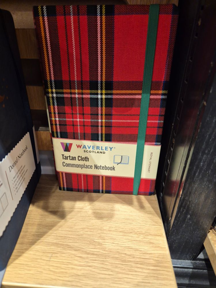 A Tartan Club "Commonplace Notebook" covered in a red tartan 