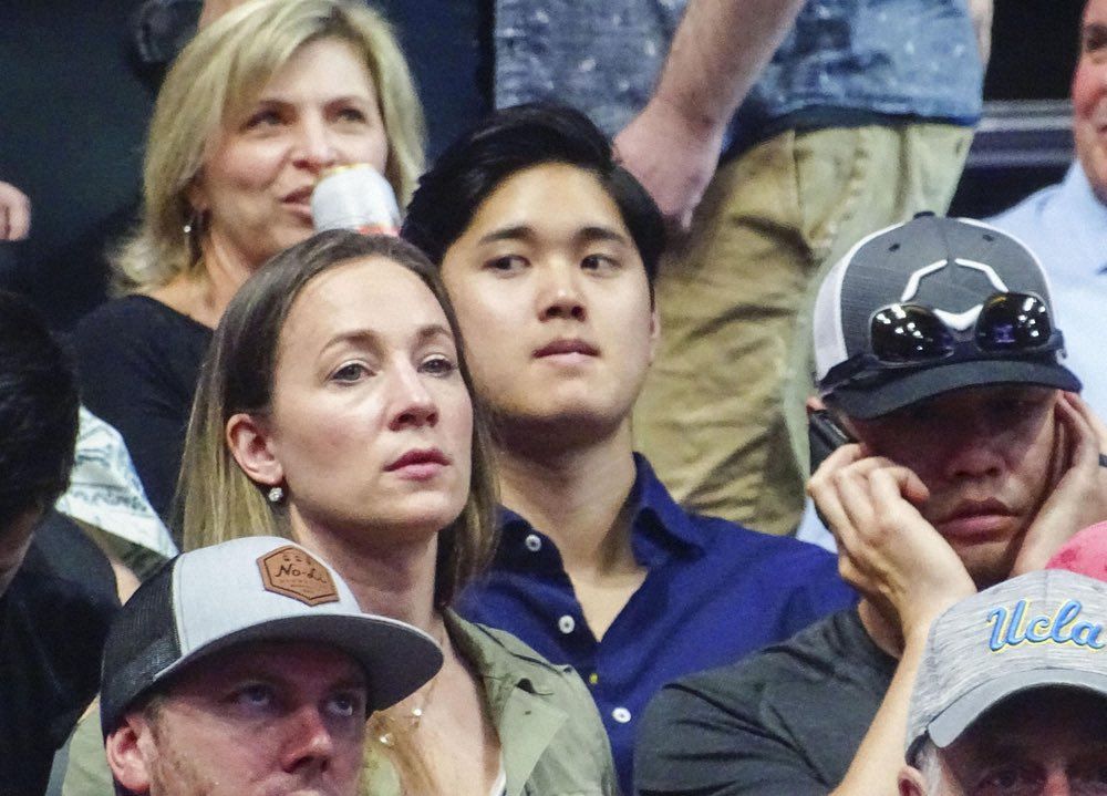 Shohei Ohtani at an NCAA March Madness game with a concerned look on his face like he is clearly sweating out his SGP