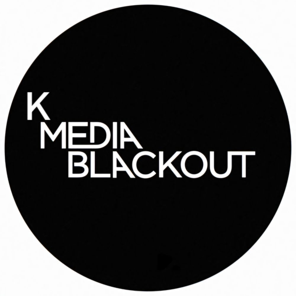 Black circle with text in white saying K Media Blackout