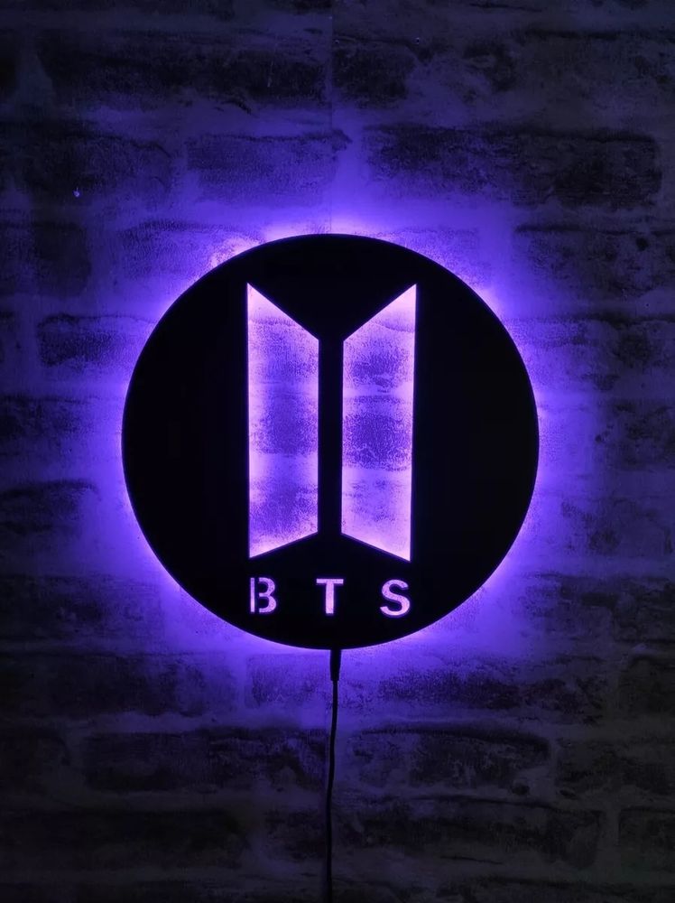 BTS logo on a purple background