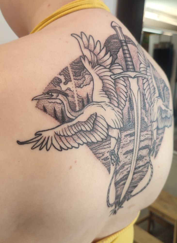A zoomed view of the details of the heron and landscape.
