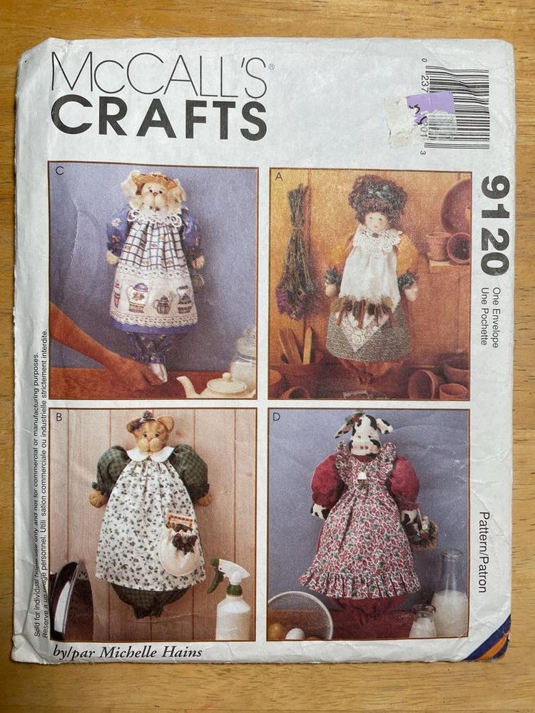 Sewing pattern to make your own plastic bag dispenser made to look like a doll wearing an apron (various human and animal faces included) 