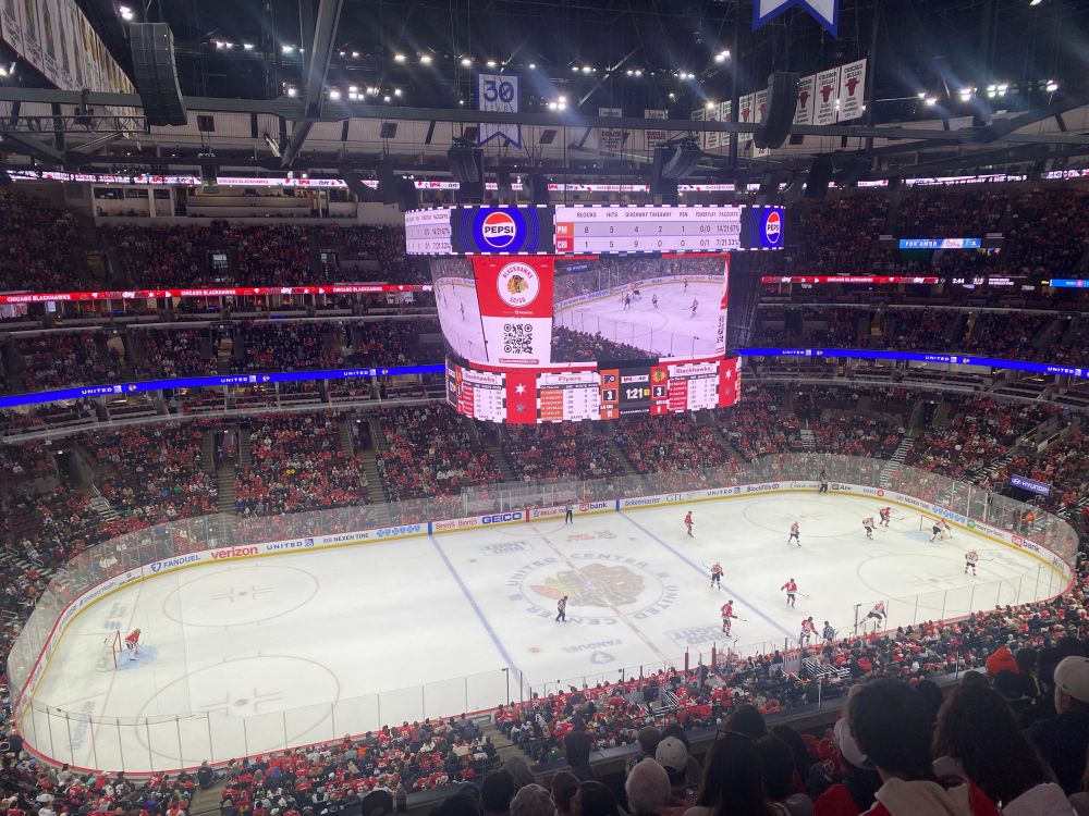 Interior of Chicago’s United Center, with the Blackhawks playing the Philadelphia Flyers in a hockey game. 