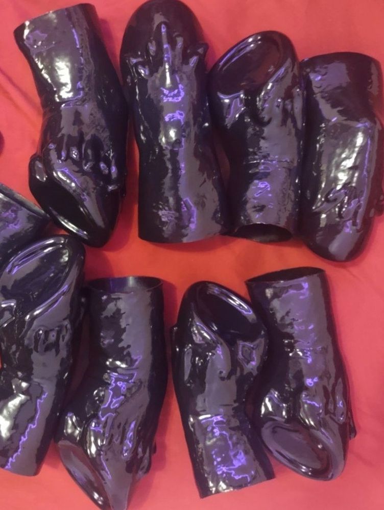 Black latex hooves meant to be worn over hands and shines with Vivishine, which is a silicone oil-based lubricant.
