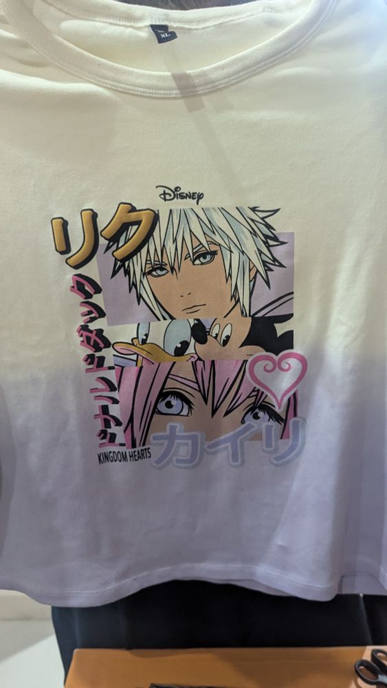 A t shirt design showing Riku, Kairi, Donald Duck and Mickey Mouse.