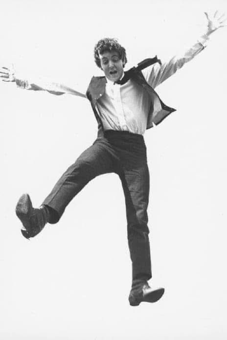 Paul McCartney jumping in the air