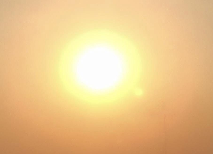 Warmth of a Sepia coloured sky. Sunset in Izmir. 