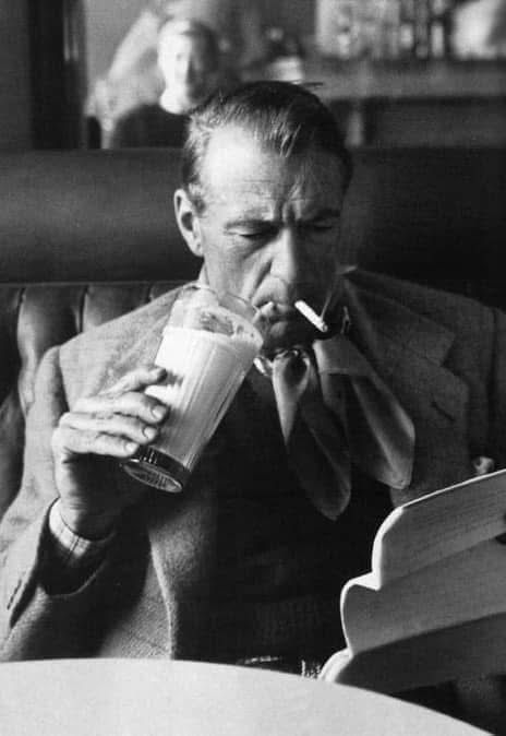 Gary Cooper reading, smoking a cigarette and drinking a milkshake. At. The. Same. Time. 