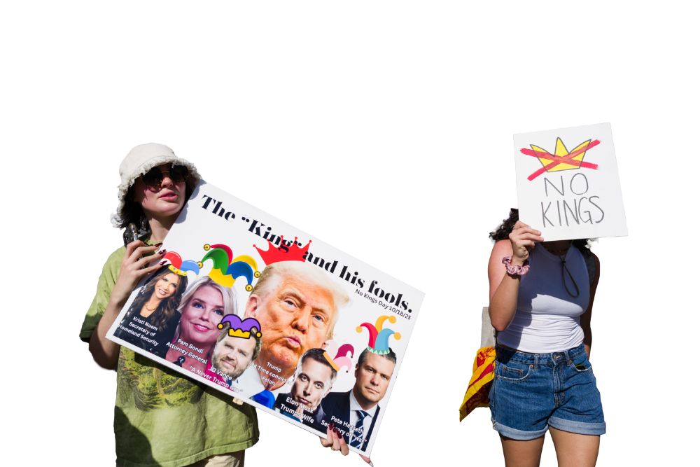 No Kings Protest - 2025/10 Austin, Texas. Procession on Congress Avenue South of the Capitol. Two protesters holding up signs.  "The King and his fools." "NO KINGS"