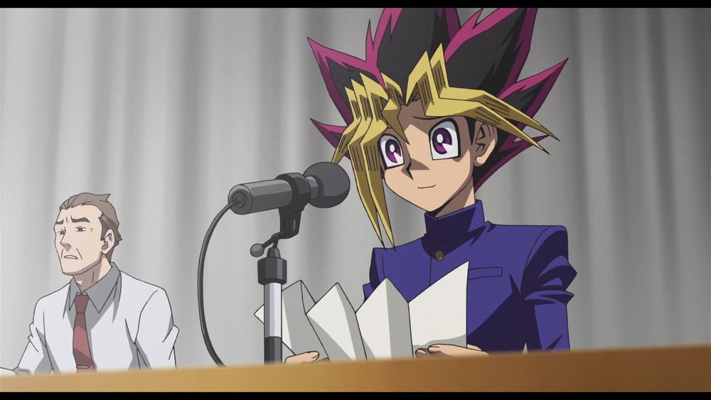 Screenshot from Dark Side Of Dimensions. Yugi is looking forwards sympathetically.