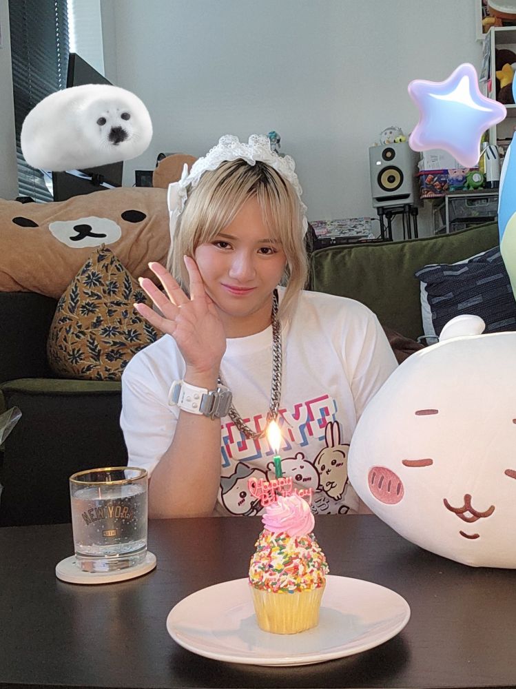 selfie with a birthday cupcake my mom got me and a glass of shochu soda, chiikawa is also here :3