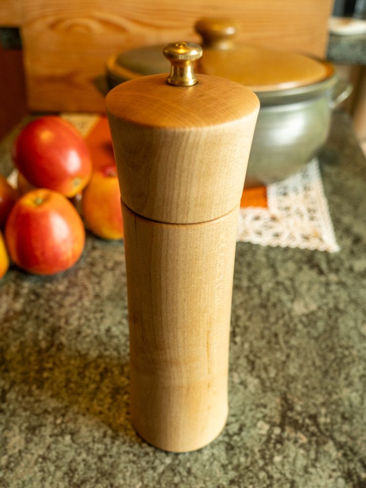 Salt mill standing on a table. It is interesting how the end grain got a much darker color after oiling compared to the face grain.