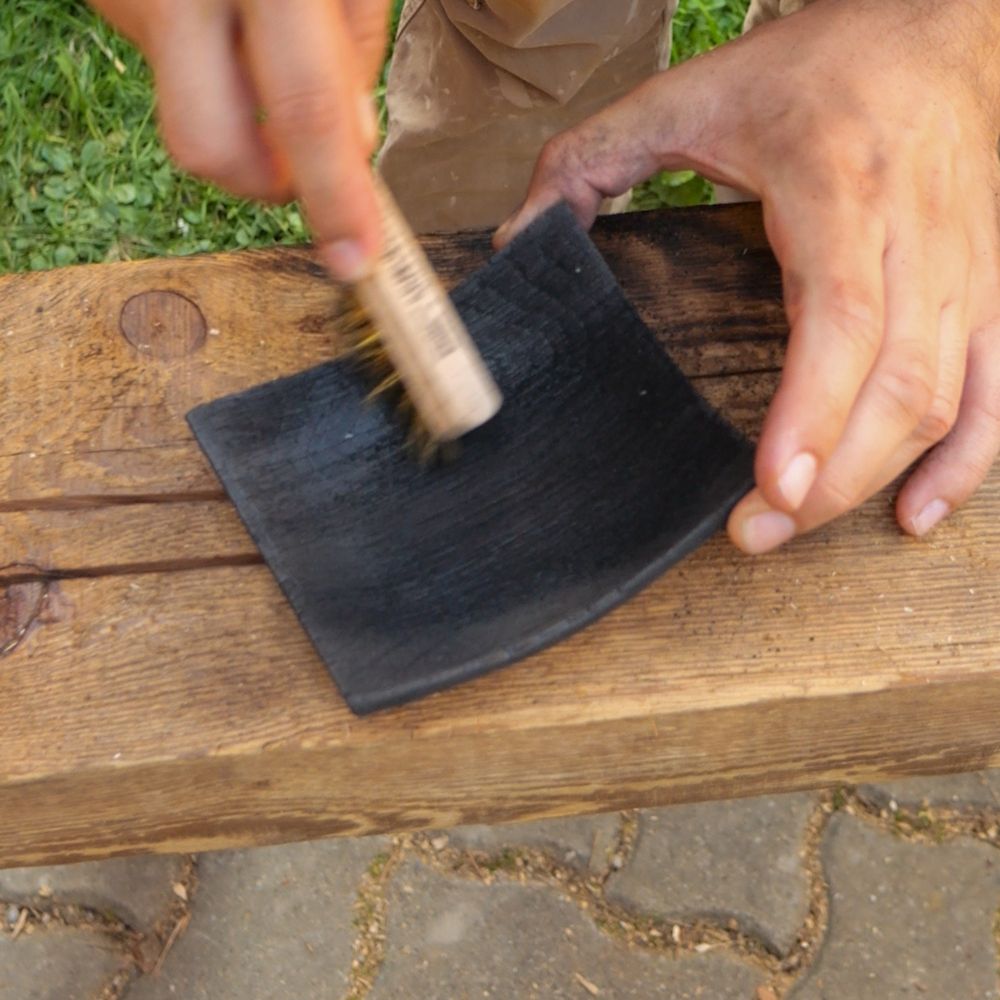 Brushing the surface. This created an interesting texture with deep rills.