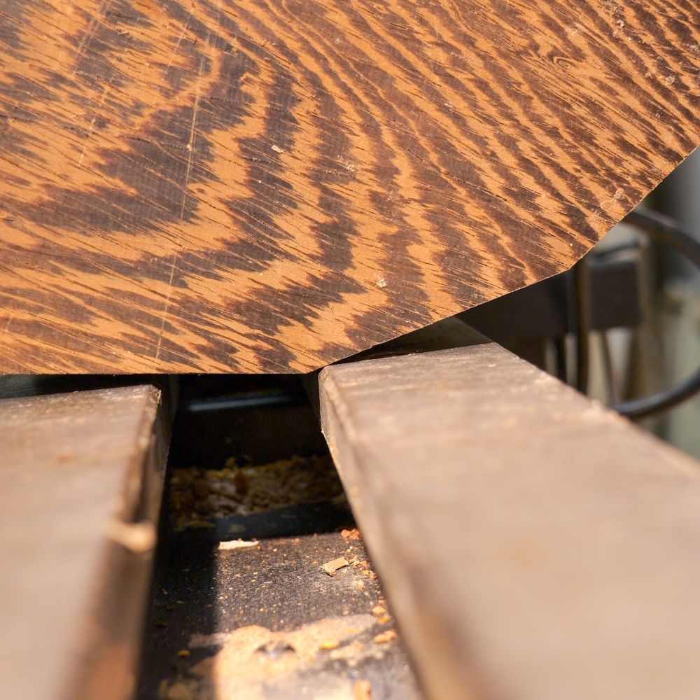 A blank of wenge on the lathe, which was still slightly too big even after cutting away the edges.