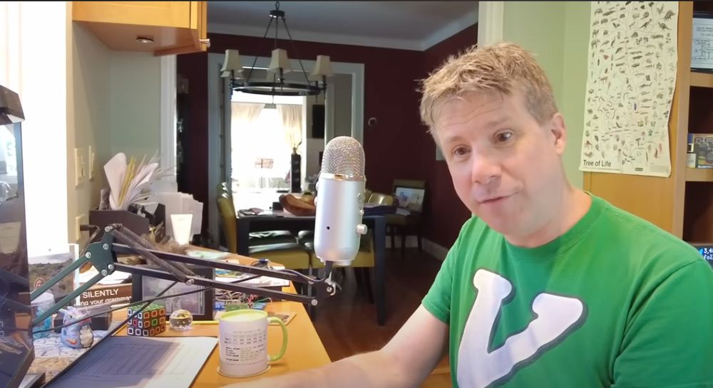 A youtube guy with a large diaphragm cardioid dynamic mic on a crane stand but his head is pointing away (off-axis) and his mouth is more than 12 inches from the capsule, completely negating the benefit of a large diaphragm cardioid dynamic mic