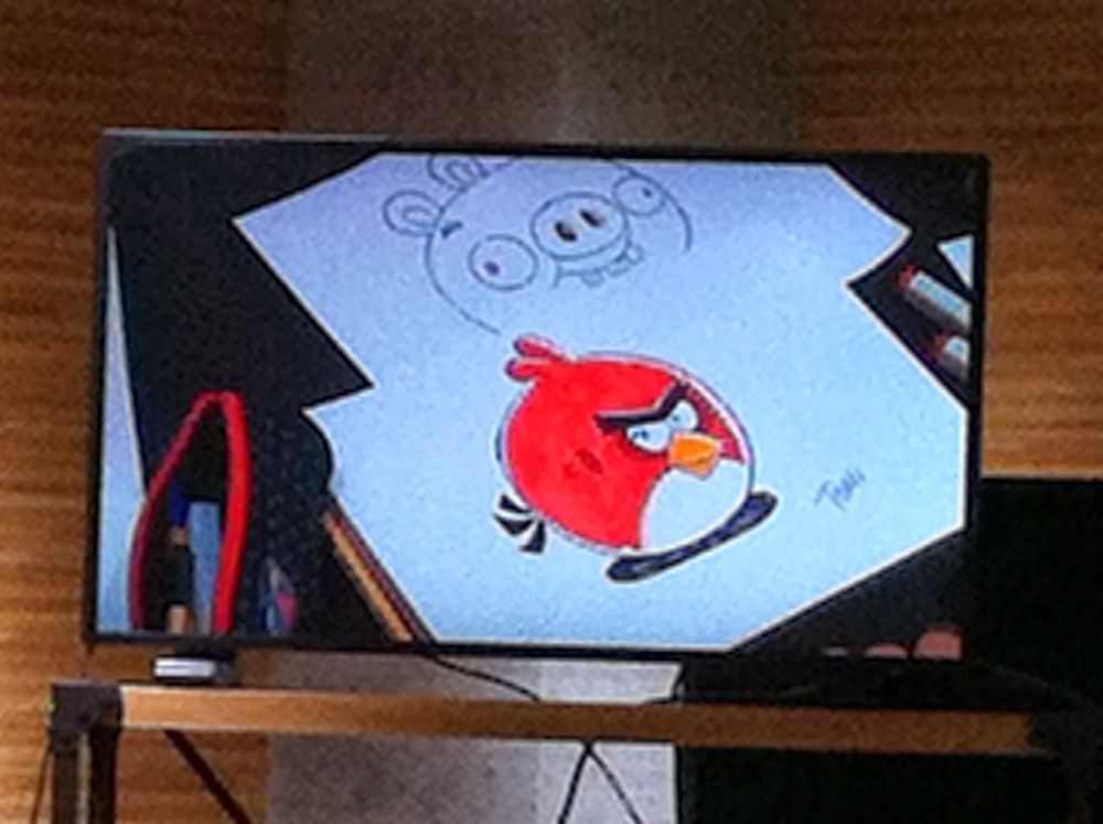 An image of Toni Kysenius' drawings of Red and a Minion Pig at the event. These were the drawings he made while showing children how to draw Angry Birds characters.