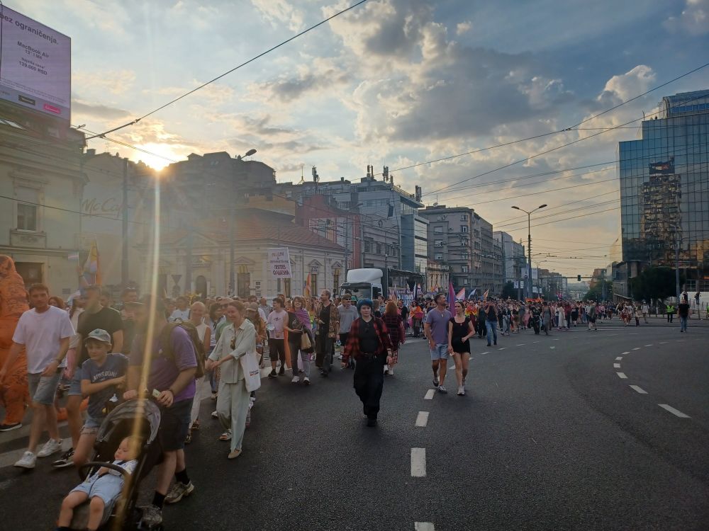 The parade marching thru a main street