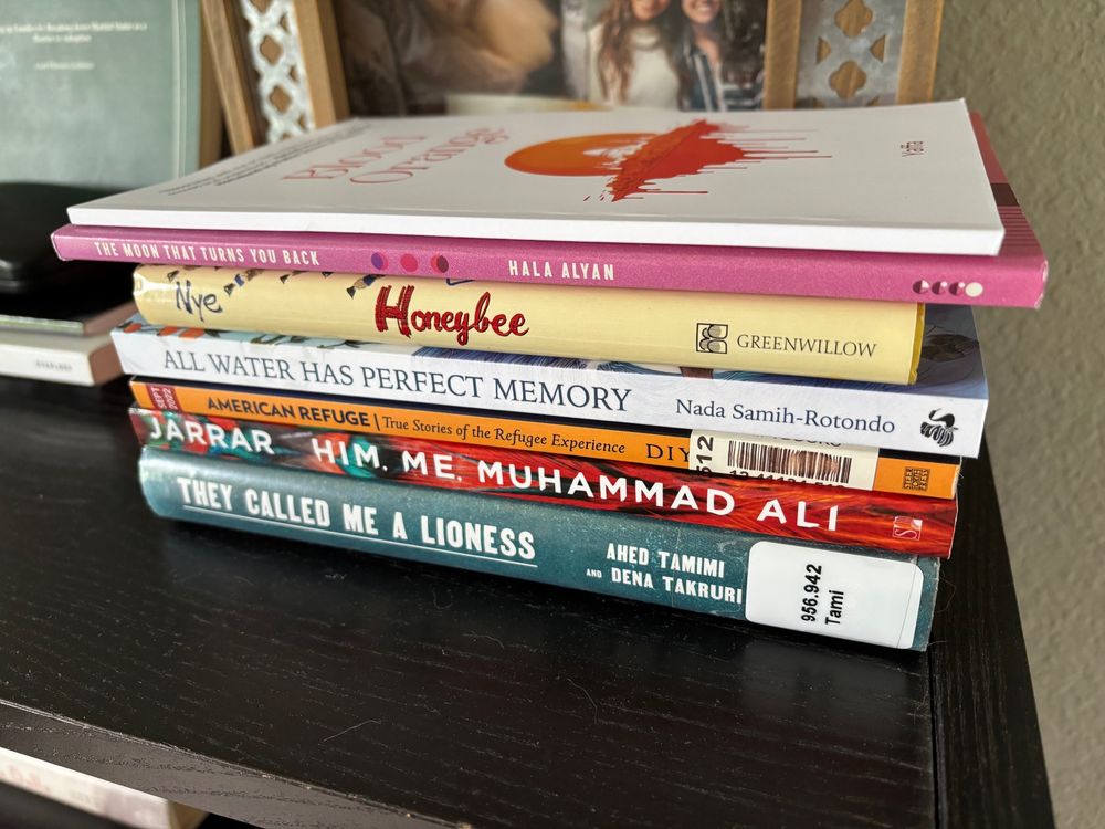 Books include: Blood Orange by Yaffa As, The Moon That Turns You Back by Hala Allan, Honeybee by Naomi Shihab Nye, All Water Has Perfect Memory by Nada Samih-Rotondo, American Refuge by Diya Abdo, Him Me Muhammad Ali by Randa Jarrar, and They Called Me A Lioness by Ahed Tamimi and Dena Takuri