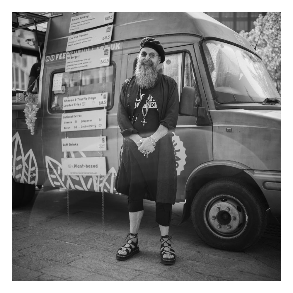 Portrait of man in kind of gothic/retro clothing.