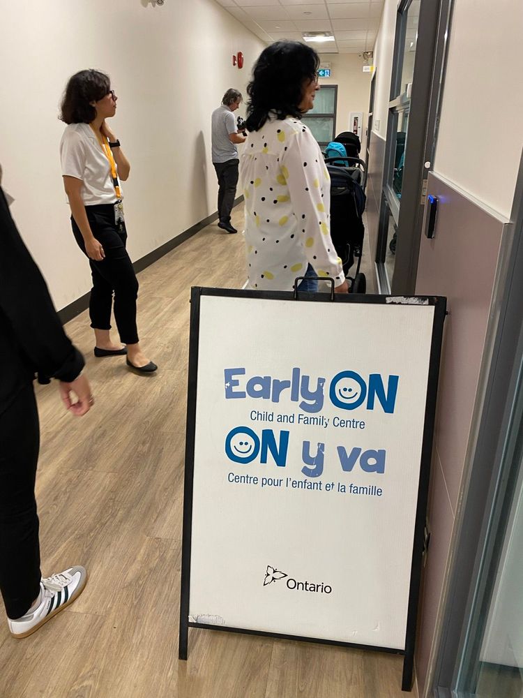 Image of people in a hallway The wayfinding says 