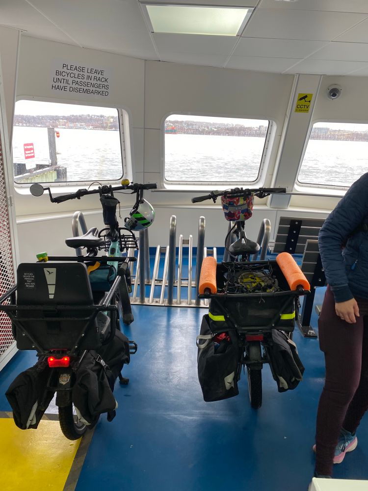 Two bikes in bike stands with the best views on a ferry