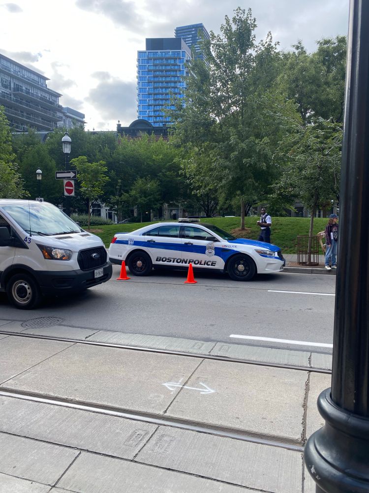 Image of a Boston police vehicle in front of a park