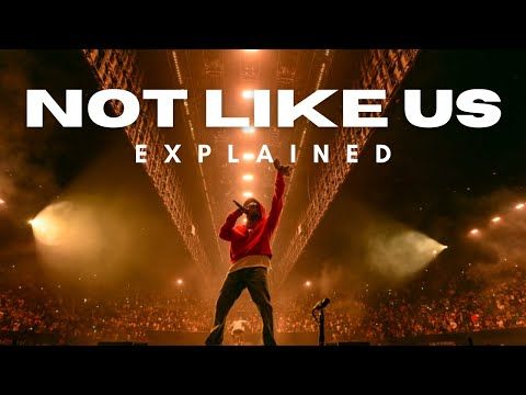 Person on a stage at a concert wearing a red hoodie

"Not Like Us Explained"